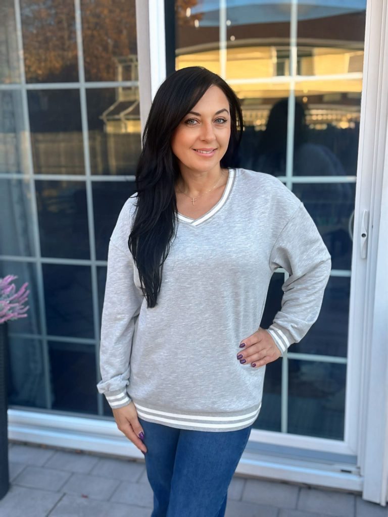 V-neck sweatshirt with striped detail!