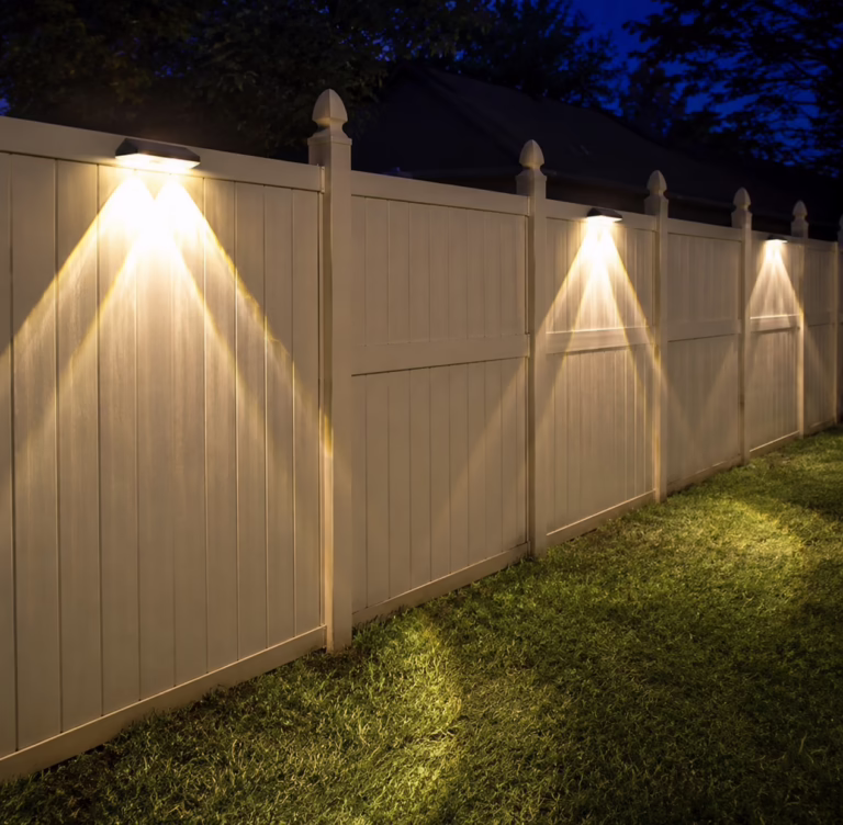 Solar-powered fence lights.